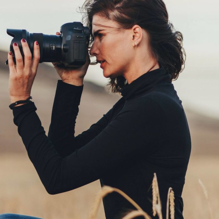 Photographer taking pictures for her website