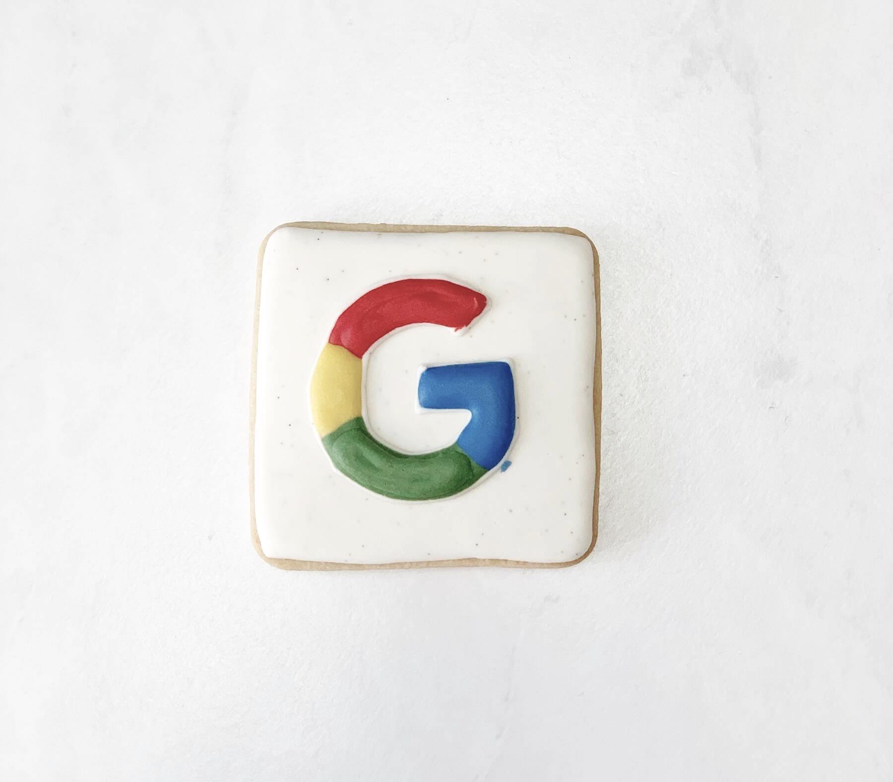 A cookie decorated with the Google logo on a white background, crafted by Elliot Olson at Studio Anansi in Portland, Oregon.
